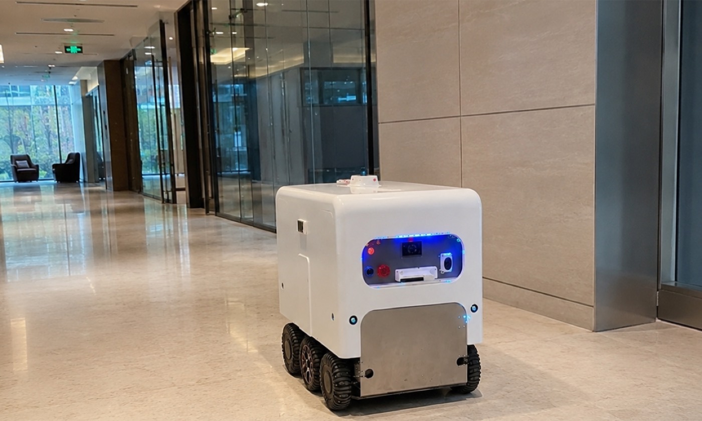 A MongBot robot working inside a modern office building